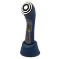EMS Skincare Revolution System, navy handheld facial device with stainless steel head, on its charging stand